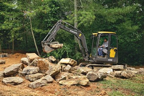 boulder placement with mini excavator|Cat Mini Excavator HUGE Boulder Retaining Wall! .